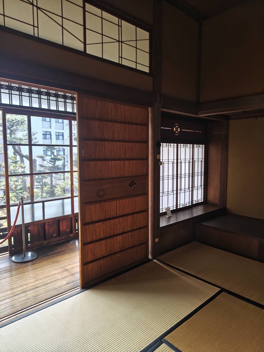 Traditional tatami room with shoji screens and a wooden veranda